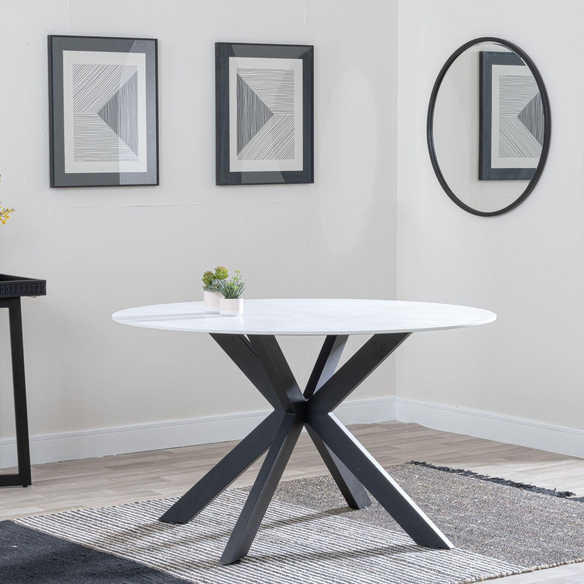 Avesta White Sintered Stone Round Dining Table with Black Star Base - 130cm