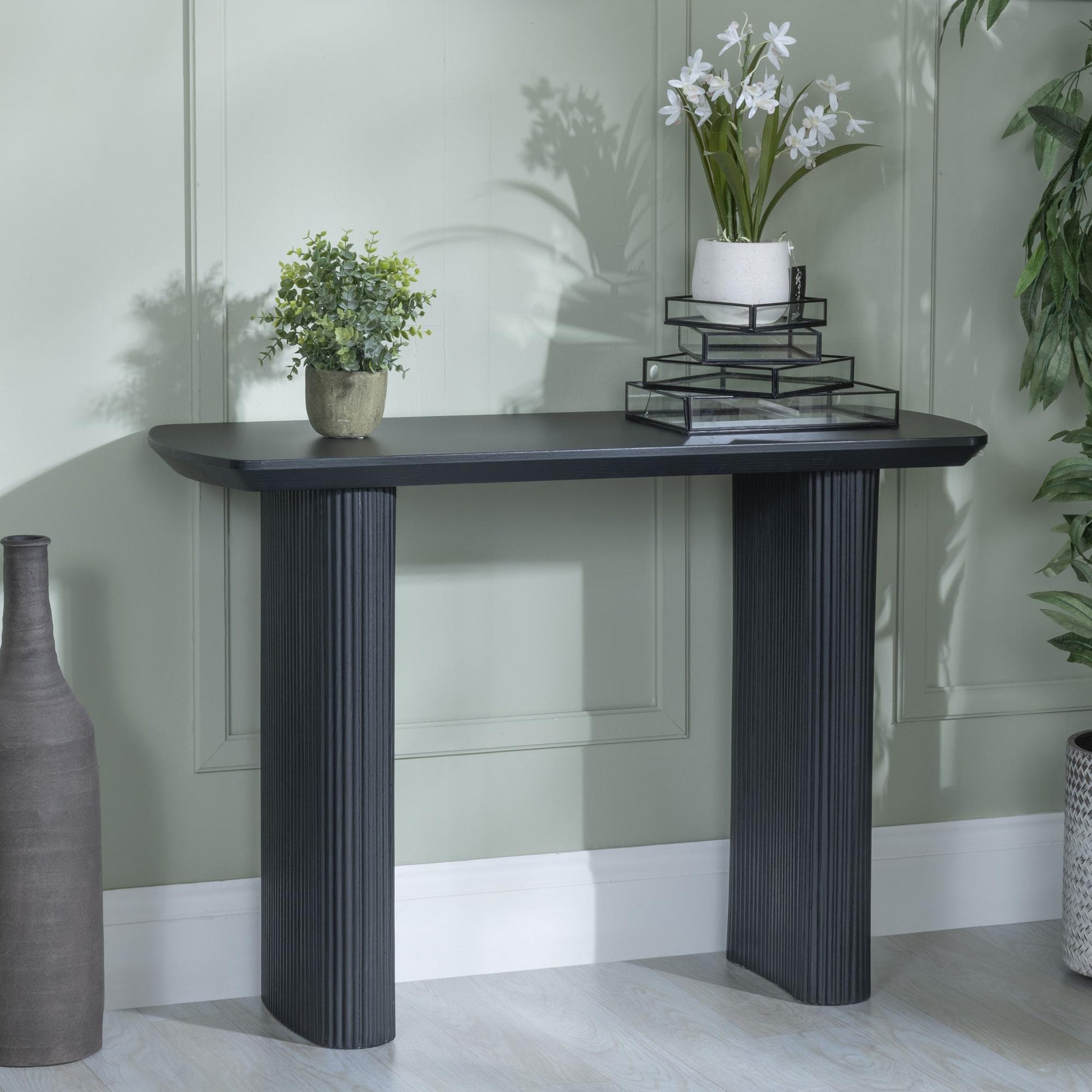 Renzo Black Oval Console Table with Fluted Ribbed Drum Base