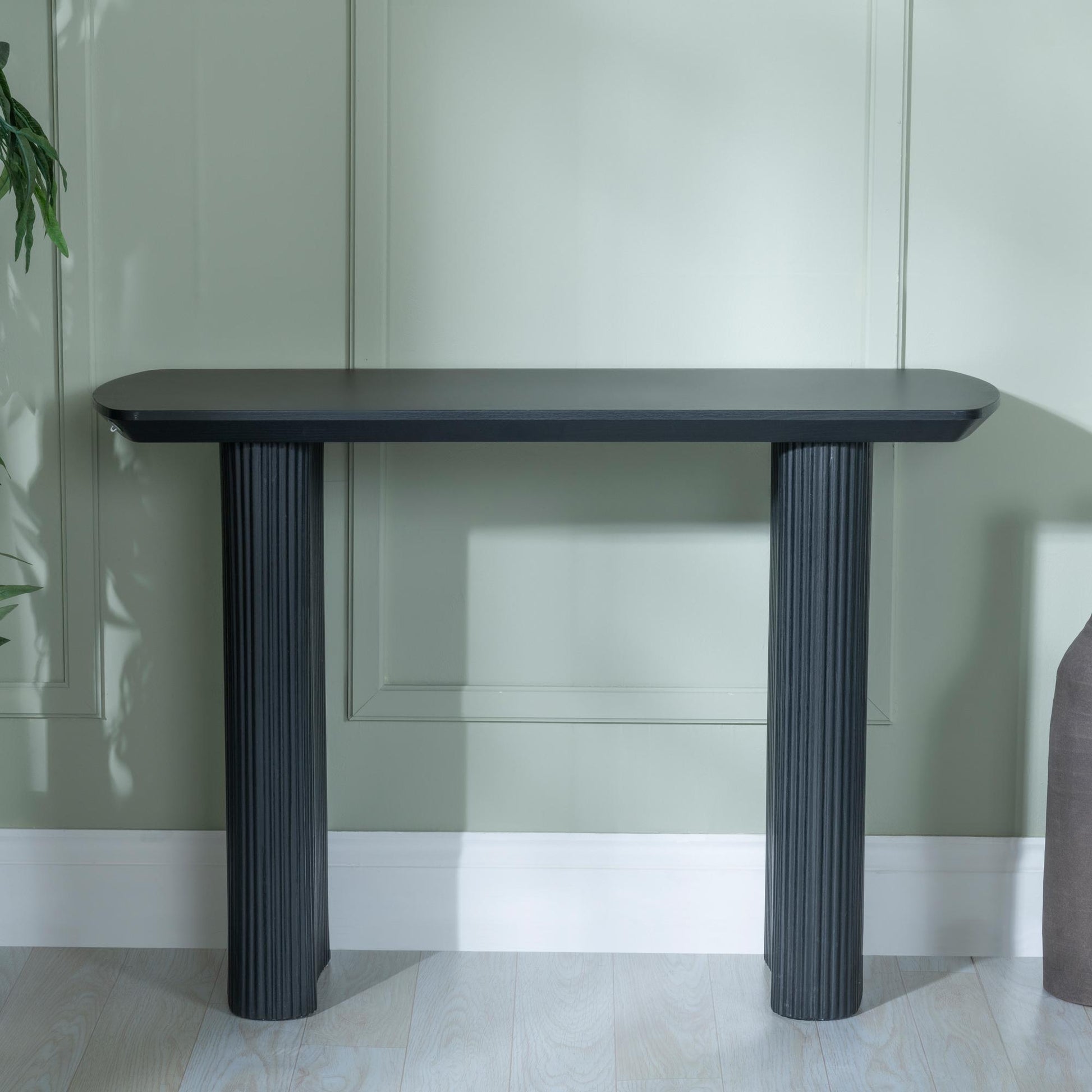 Renzo Black Oval Console Table with Fluted Ribbed Drum Base